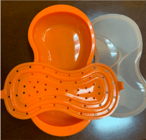 一個塑膠容器，有一個橙色蓋子和一個白色蓋子。